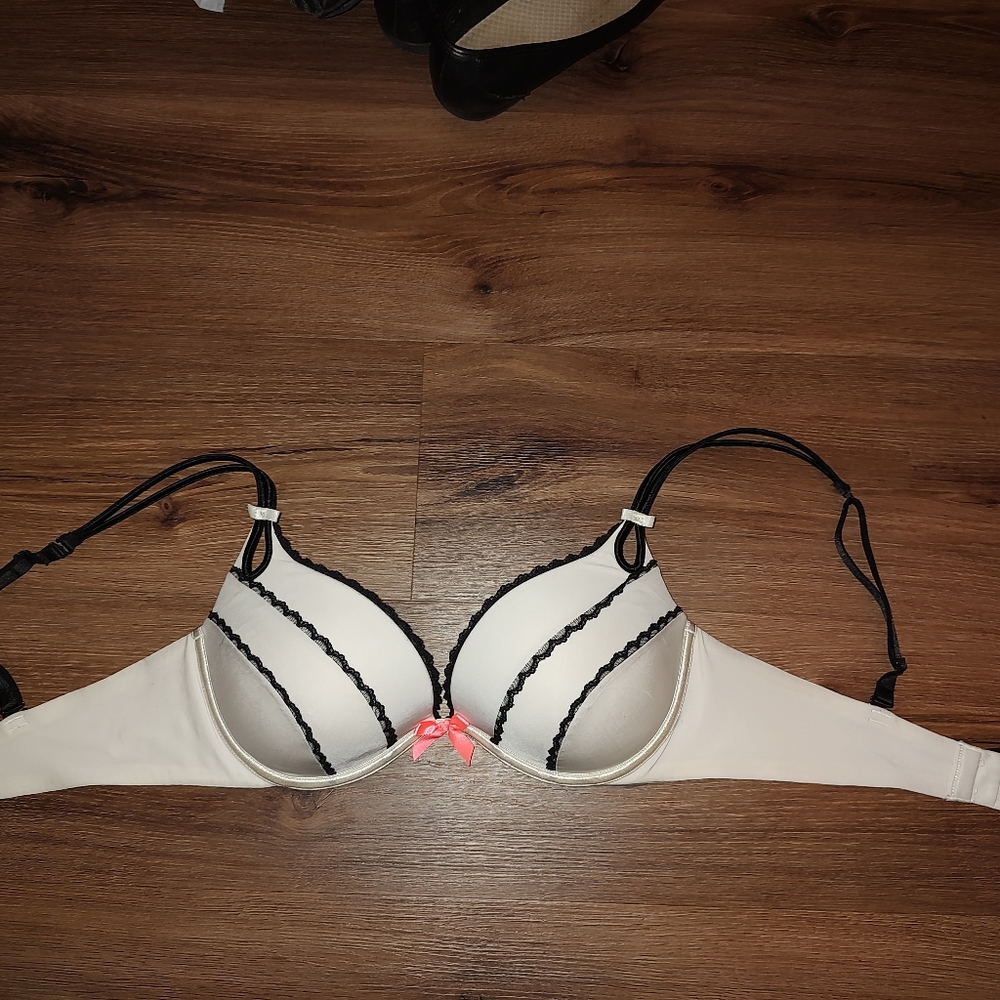 Victoria Secret sexy white/creme colored bra with black stripes/pink bow